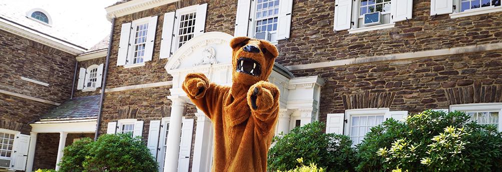 Nittany Lion mascot in front of Hayfield House